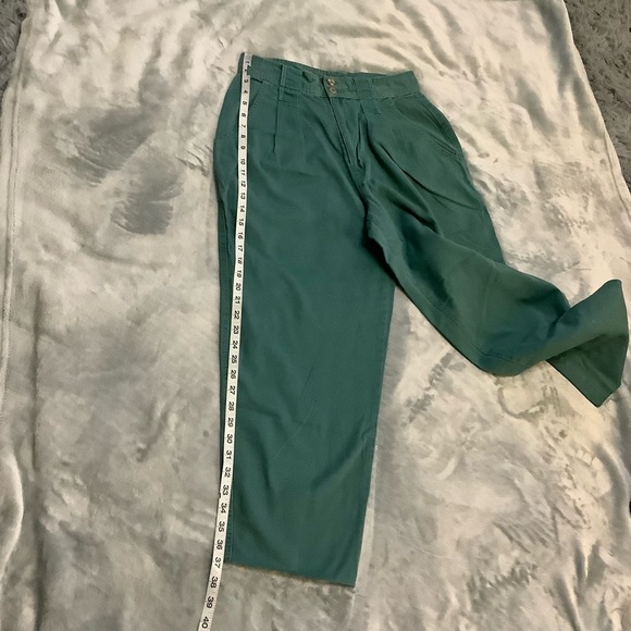 Cut off bottom of pants and small faded area is circled. - Picture 1 of 12